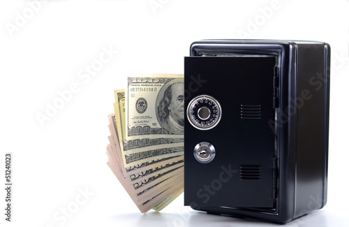 Photo: Steel safe with money , money saving concept Steel safe with money , money saving concept
