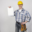 Photo: young builder with blank in hand young builder with blank in hand