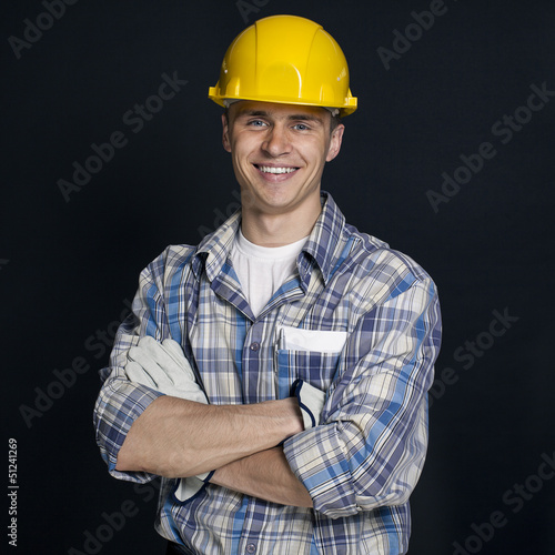 Photo: portrait of a young builder portrait of a young builder