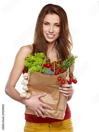 Photo: Young woman with a grocery shopping bag. Isolated on white backg Young woman with a grocery shopping bag. Isolated on white backg