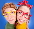 Foto: Happy nerdy couple embracing Happy nerdy couple embracing