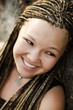 Beautiful smiling girl with brown braids
