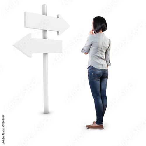 Photo: Girl before a roadsign Girl before a roadsign