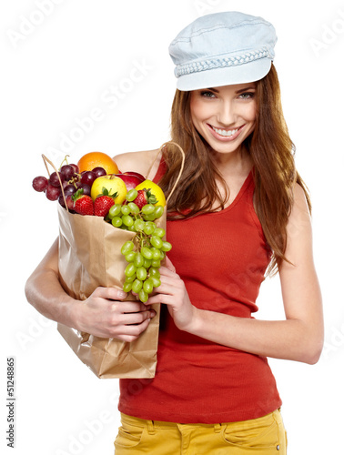 Photo: Young woman with a grocery shopping bag. Isolated on white backg Young woman with a grocery shopping bag. Isolated on white backg
