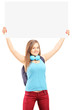Beautiful young female with school backpack holding a white pane