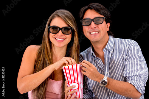 Photo: Couple watching movie in 3D Couple watching movie in 3D