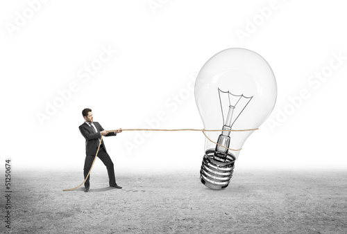Photo: man pulling lamp man pulling lamp