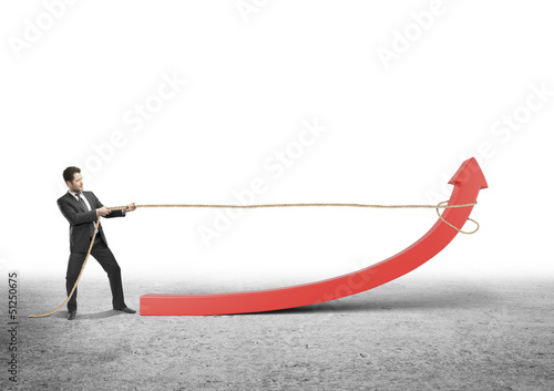 Photo: man pulling arrow man pulling arrow