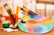 Artistic equipment: paint, brushes and art palette