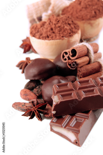Photo: Composition of chocolate sweets, cocoa and spices, isolated Composition of chocolate sweets, cocoa and spices, isolated