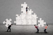 Business teamwork building puzzle