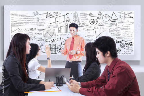 Photo: Business presentation on whiteboard Business presentation on whiteboard