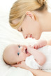 happy mother with baby over white
