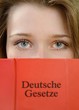 Buch und Gesicht mit dem Thema Deutsche Gesetze