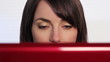 Woman at computer nodding off.
