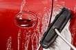 Cleaning the car with a brush
