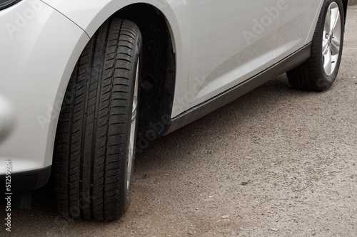 Photo: Set of new tyres on a car Set of new tyres on a car