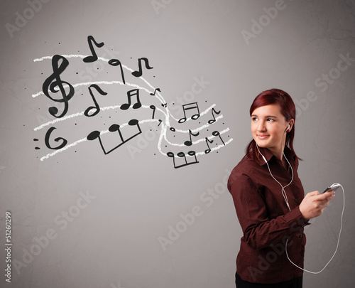 Photo: attractive young lady singing and listening to music with musica attractive young lady singing and listening to music with musica