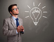 Young boy comming up with a light bulb idea sign