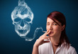 Young woman smoking dangerous cigarette with toxic skull smoke