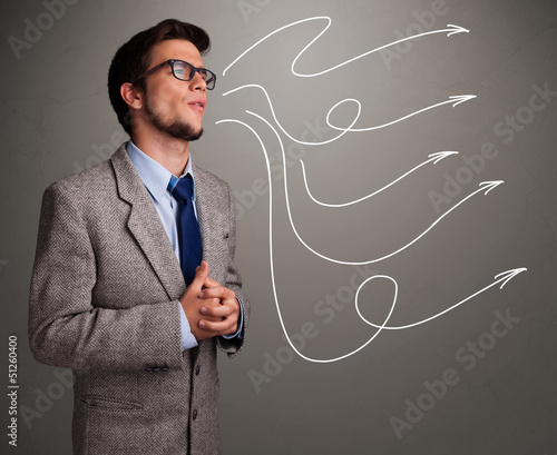Photo: Attractive man looking at multiple curly arrows Attractive man looking at multiple curly arrows