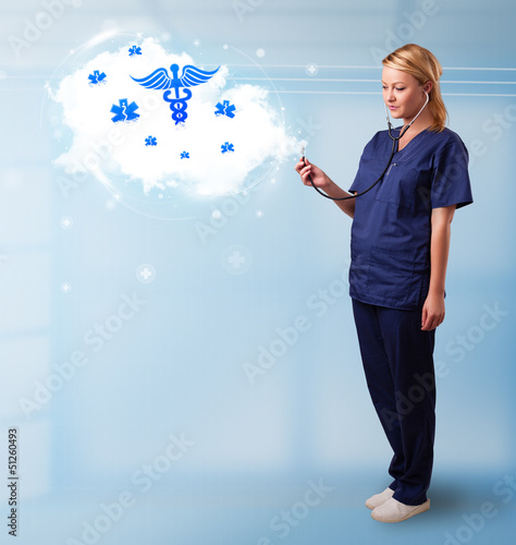 Photo: Young doctor with abstract cloud and medical icons Young doctor with abstract cloud and medical icons