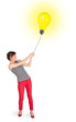 Happy woman holding a light bulb balloon