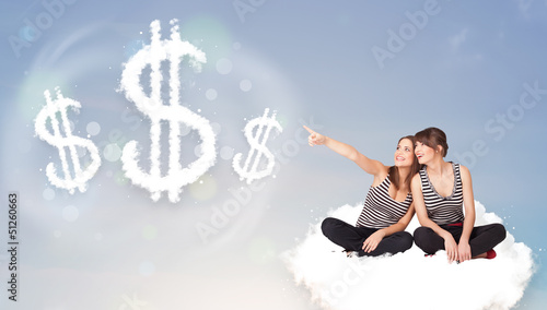Photo: Young women sitting on cloud next to cloud dollar signs Young women sitting on cloud next to cloud dollar signs