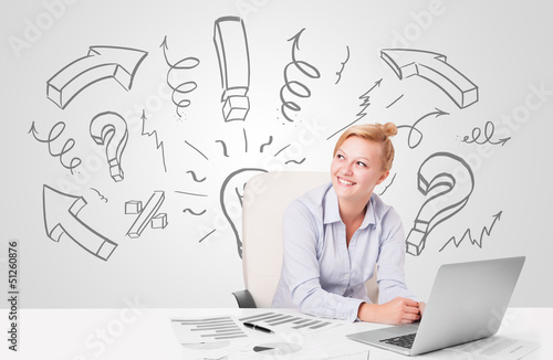Photo: Attractive businesswoman brainstorming with drawn arrows and sym Attractive businesswoman brainstorming with drawn arrows and sym
