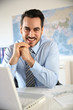 Portrait of businessman sitting in office