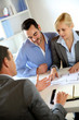 Couple meeting real-estate agent to buy property