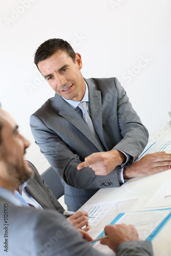 Photo: Businessman making marketing presentation Businessman making marketing presentation