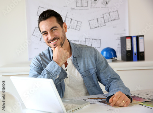 Photo: Portrait of architect working on project Portrait of architect working on project