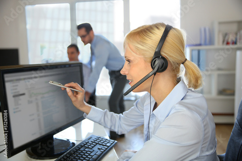 Photo: Customer service operator talking on the phone Customer service operator talking on the phone
