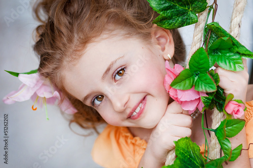 Photo: Portrait of a beautiful girl with flowers Portrait of a beautiful girl with flowers