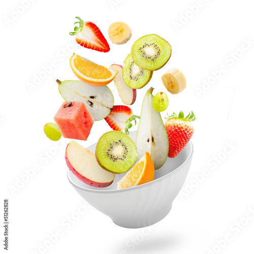 Photo: Light salad with flying fresh fruits Light salad with flying fresh fruits