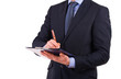 Businessman writing notes on clipboard.
