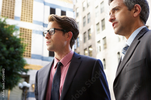 Photo: Two Businessman Chatting Outside Office Two Businessman Chatting Outside Office