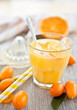 canvas print picture - Fresh juice from oranges and kumquats