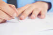 Businessman writing a note