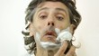 man with shaving cream over white