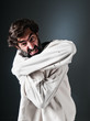 Crazy man on straitjacket