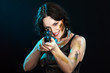 Beautiful woman holding weapon