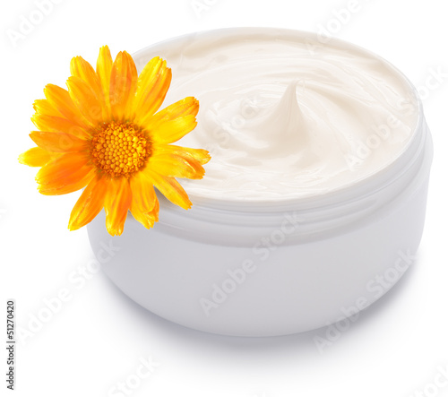 Photo: Jar of cream and calendula flower. Jar of cream and calendula flower.