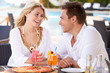 Photo: Couple Enjoying Meal In Outdoor Restaurant Couple Enjoying Meal In Outdoor Restaurant