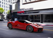 red concept sportscar in the city