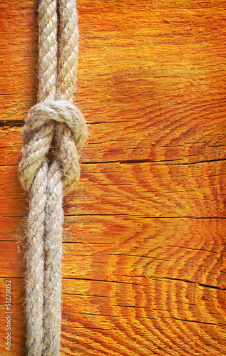 Photo: rope on wooden background rope on wooden background