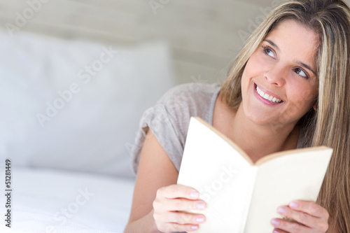 Photo: Thoughtful woman reading a book Thoughtful woman reading a book
