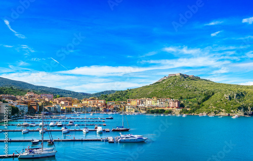 Photo: Porto Ercole village and harbor in a sea bay. Aerial view, Argen Porto Ercole village and harbor in a sea bay. Aerial view, Argen