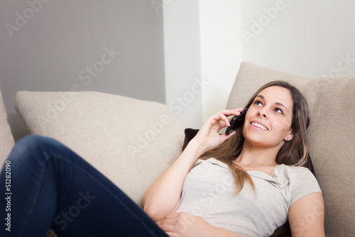 Photo: Woman using a mobile phone Woman using a mobile phone